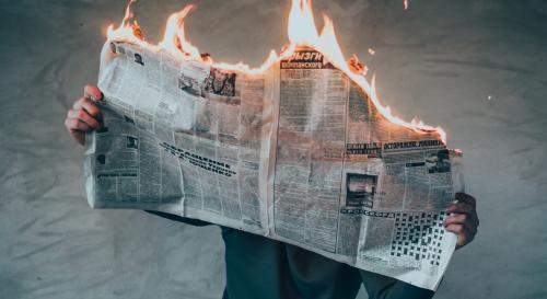 Newspaper on fire