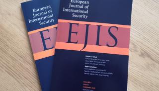 EJIS journals on a coffee table