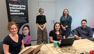 Ruth Blakeley, Julia Welland, Danielle Beswick, Juliet Dryden and Mark Webber in a meeting room