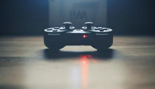 black game controller on table