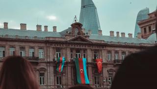 Building in Baku, Azerbaijan with flags hanging down