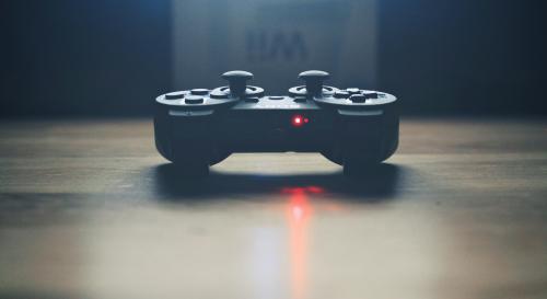 black game controller on table