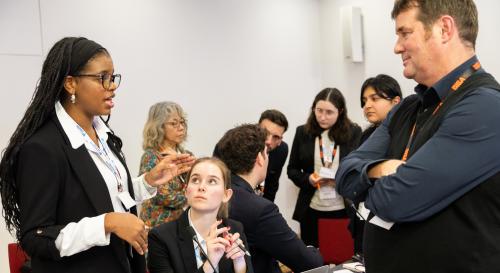 Several politics and IR students taking part in the BISA climate simulation event at Chatham House