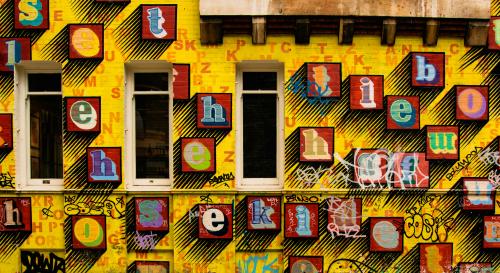 Alphabet letters set on a bright yellow wall