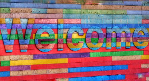 Multicoloured sign that says welcome