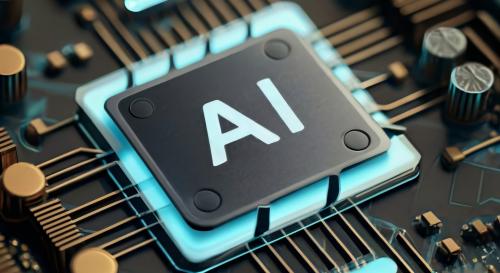 An image of a computer chip with the word AI written on it.